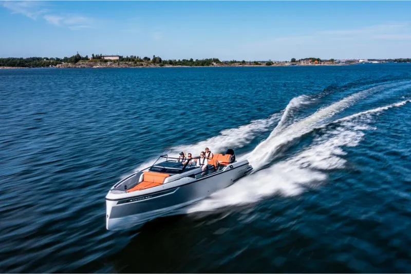 Slide: The Image of 2023 Saxdor 320 GTR speedboat cruising on open water. - 4