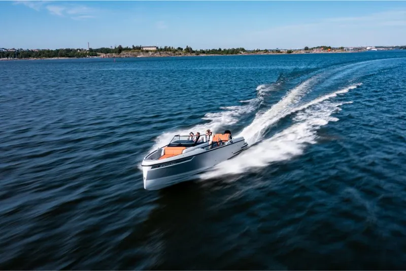 Slide: The Image of 2023 Saxdor 320 GTR speedboat cruising on open water. - 5