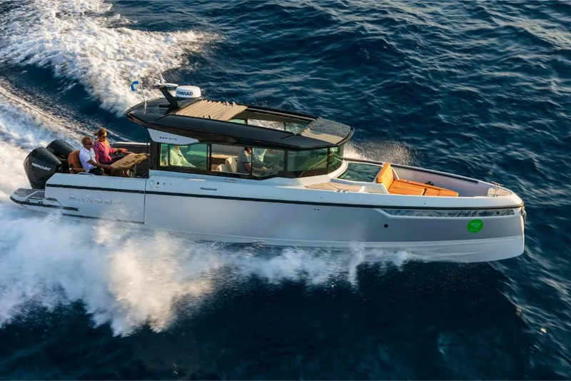 Slide: The Image of 2023 Saxdor 320 GTC cruising on open water. - 15