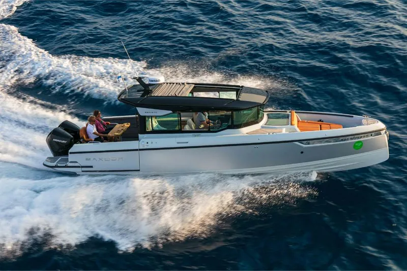 Slide: The Image of 2023 Saxdor 320 GTC cruising on open water. - 16