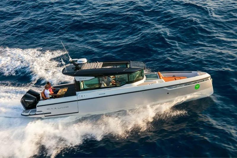 Slide: The Image of 2023 Saxdor 320 GTC cruising on open water. - 18