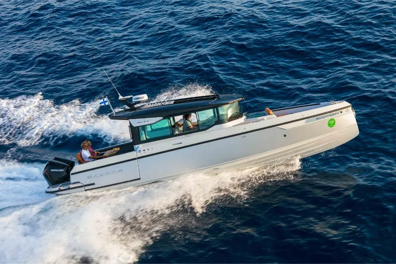 Slide: The Image of 2023 Saxdor 320 GTC motorboat cruising on open water. - 19