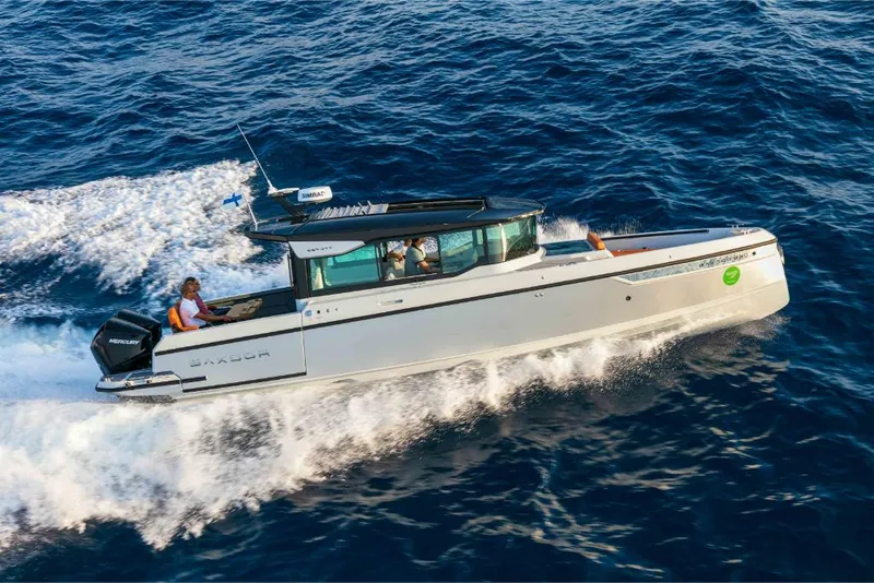 Slide: The Image of 2023 Saxdor 320 GTC motorboat cruising on open water. - 20