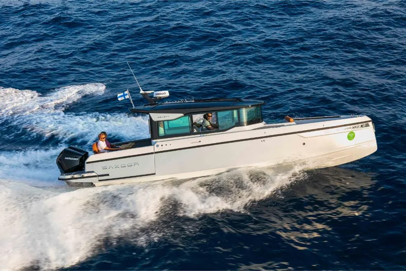 Slide: The Image of 2023 Saxdor 320 GTC motorboat cruising on open water. - 21