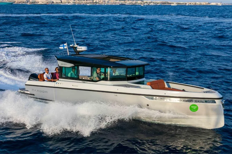 Slide: The Image of 2023 Saxdor 320 GTC motorboat cruising on open water. - 22