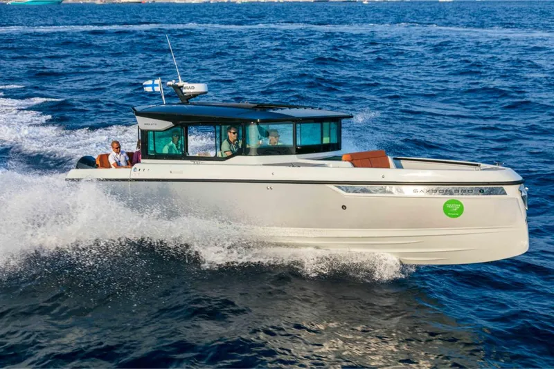 Slide: The Image of 2023 Saxdor 320 GTC cruising on open water. - 23