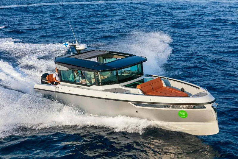 Slide: The Image of 2023 Saxdor 320 GTC cruising on open water. - 24