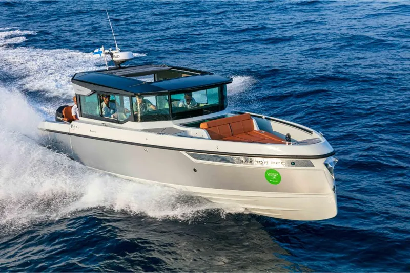 Slide: The Image of 2023 Saxdor 320 GTC motorboat cruising on open water. - 26