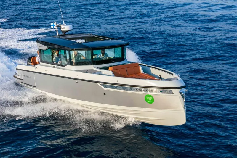 Slide: The Image of 2023 Saxdor 320 GTC motorboat cruising on open water. - 27