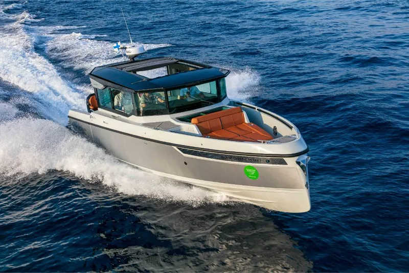 Slide: The Image of 2023 Saxdor 320 GTC motorboat cruising on open water. - 28