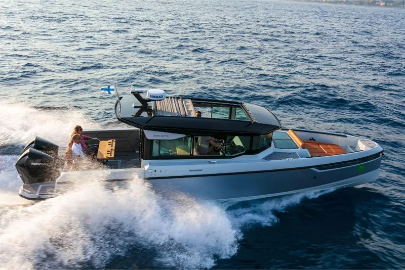 Slide: The Image of 2023 Saxdor 320 GTC cruising on open water. - 3