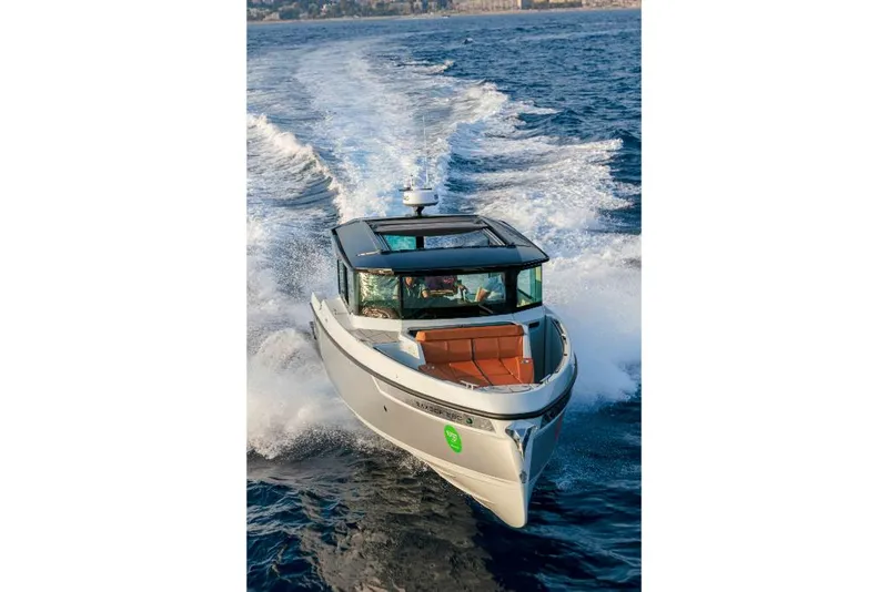 Slide: The Image of 2023 Saxdor 320 GTC boat cruising on open water. - 38