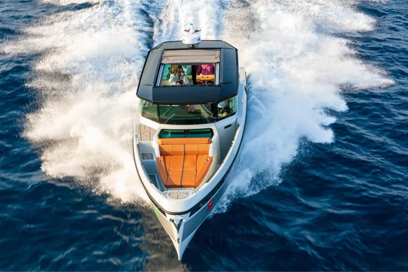Slide: The Image of 2023 Saxdor 320 GTC luxury motorboat cruising on open water. - 39
