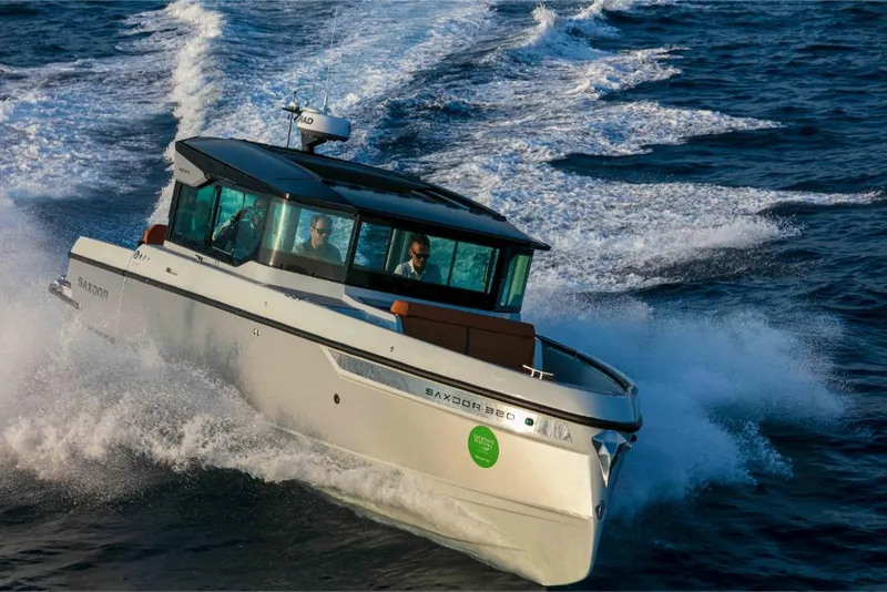 Slide: The Image of 2023 Saxdor 320 GTC boat cruising on open water. - 44