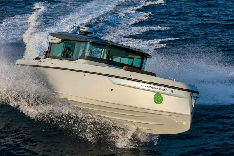 Slide: The Image of 2023 Saxdor 320 GTC motorboat cruising on open water. - 45