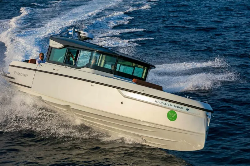 Slide: The Image of 2023 Saxdor 320 GTC boat cruising on open water. - 46