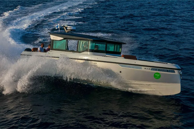 Slide: The Image of 2023 Saxdor 320 GTC cruising on open water, creating a splash. - 48
