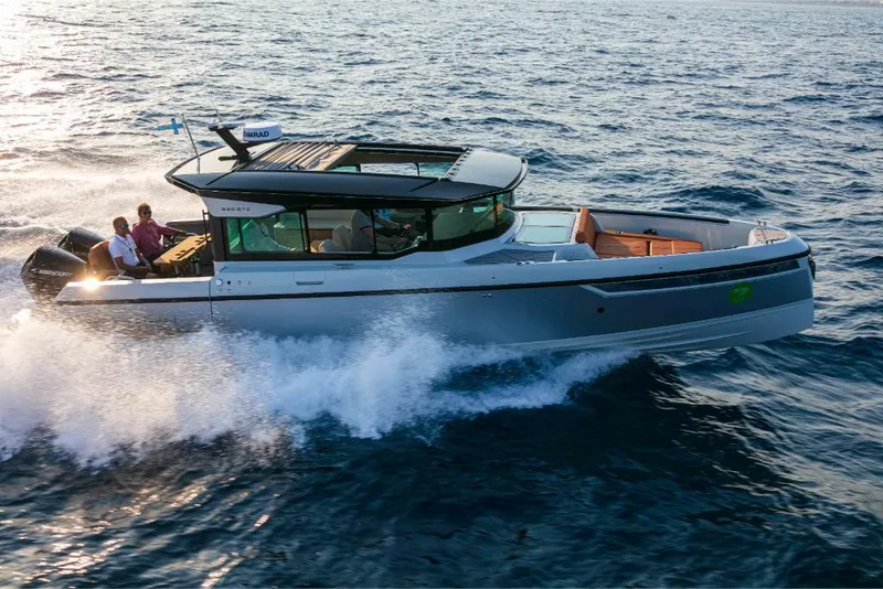 Slide: The Image of 2023 Saxdor 320 GTC cruising on open water. - 5