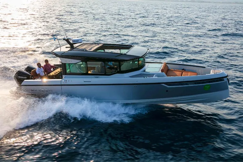 Slide: The Image of 2023 Saxdor 320 GTC cruising on open water. - 6