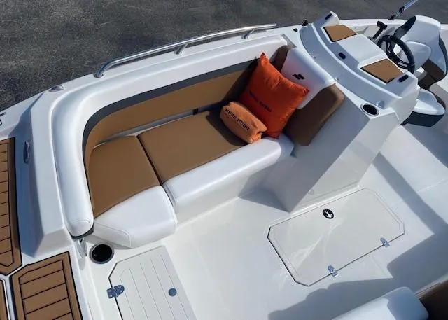 Slide: The Image of 2022 Starcraft SVX 191 OB boat interior with tan and white seating. - 10