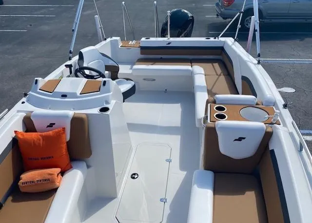 Slide: The Image of 2022 Starcraft SVX 191 OB boat interior with tan and white seating. - 11