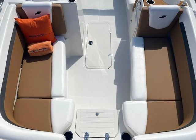 Slide: The Image of 2022 Starcraft SVX 191 OB boat interior with tan and white seating. - 12