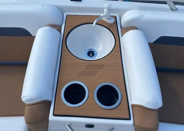 Slide: The Image of 2022 Starcraft SVX 191 OB boat sink and cup holders. - 17