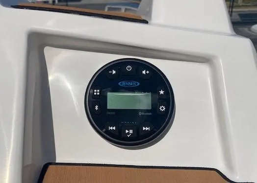 Slide: The Image of 2022 Starcraft SVX 191 OB boat dashboard with Jensen marine audio system. - 22