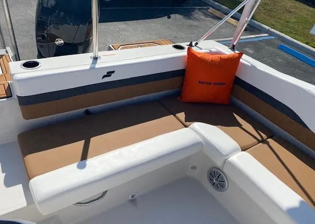 Slide: The Image of 2022 Starcraft SVX 191 OB boat interior with tan and white seating. - 25