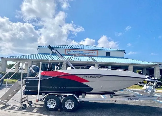 Slide: The Image of 2022 Starcraft SVX 191 OB boat on trailer outside Nautical Ventures dealership. - 3