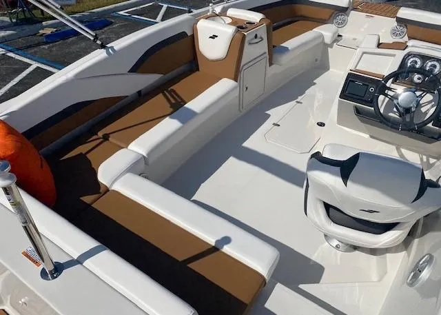 Slide: The Image of 2022 Starcraft SVX 191 OB boat interior with brown and white seating. - 33