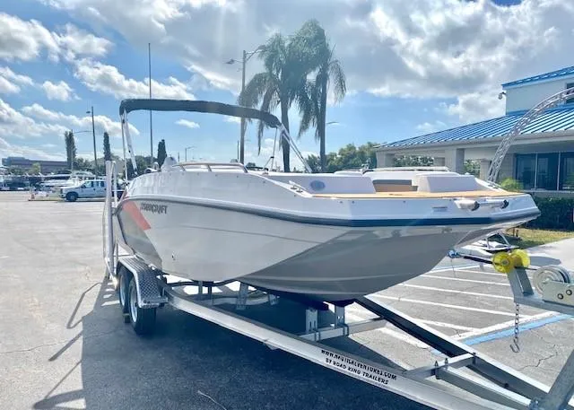 Slide: The Image of 2022 Starcraft SVX 191 OB boat on a trailer in a parking lot. - 4