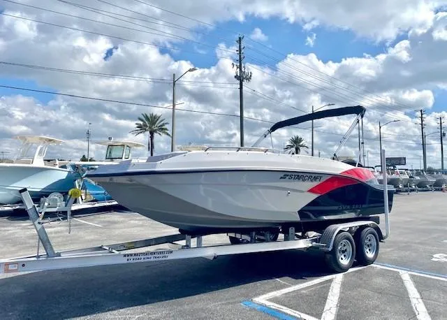 Slide: The Image of 2022 Starcraft SVX 191 OB boat on a trailer in a parking lot. - 6