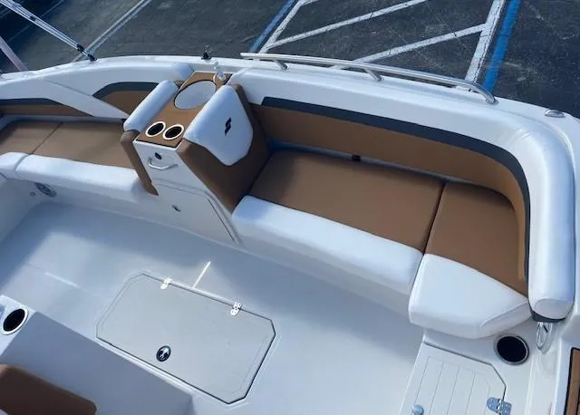 Slide: The Image of 2022 Starcraft SVX 191 OB boat interior with tan and white seating. - 8