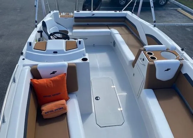 Slide: The Image of 2022 Starcraft SVX 191 OB boat interior with tan and white seating. - 9