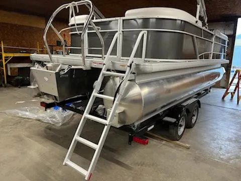Slide: The Image of 2023 Godfrey 2286SBCX pontoon boat on trailer in a garage. - 4