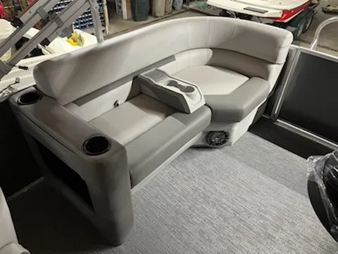 Slide: The Image of 2023 Godfrey 2286SBCX boat interior seating with cup holders and storage compartments. - 7