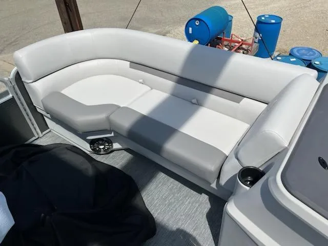 Slide: The Image of 2023 Godfrey 2286SBCX pontoon boat with white and gray seating. - 9