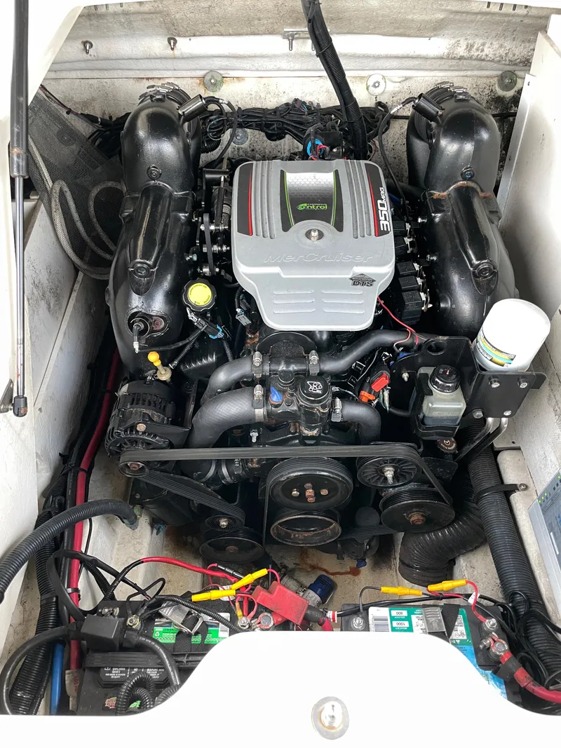 Slide: The Image of Engine compartment of a 2015 Sea Ray 240 Sundeck boat. - 13