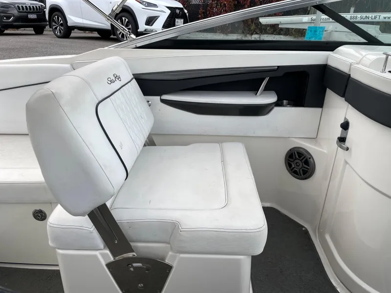 Slide: The Image of 2015 Sea Ray 240 Sundeck interior seating and console. - 6