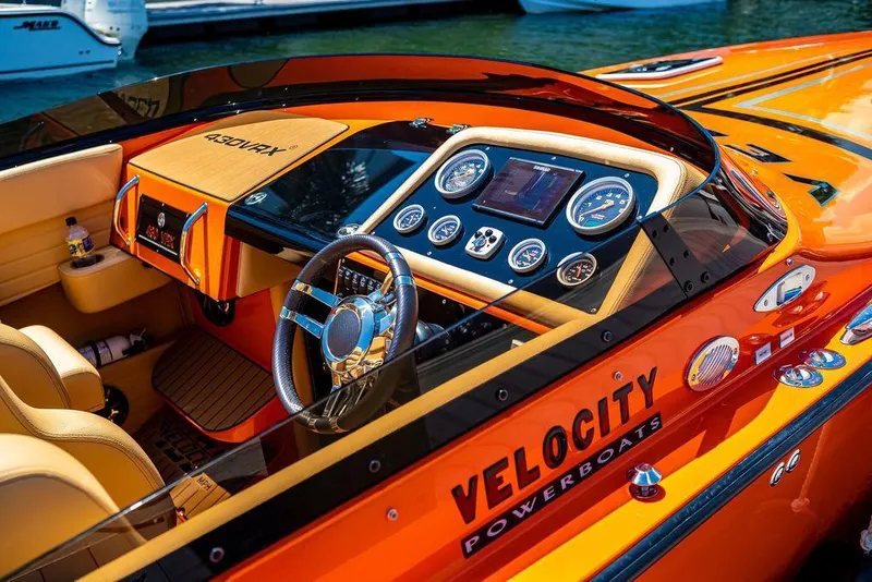 Slide: The Image of 2024 Velocity 430VRX powerboat interior with modern dashboard and controls. - 8