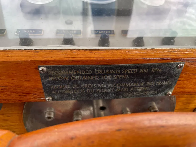 Slide: The Image of 1974 Custom Center Cockpit dashboard with cruising speed plaque and controls. - 7