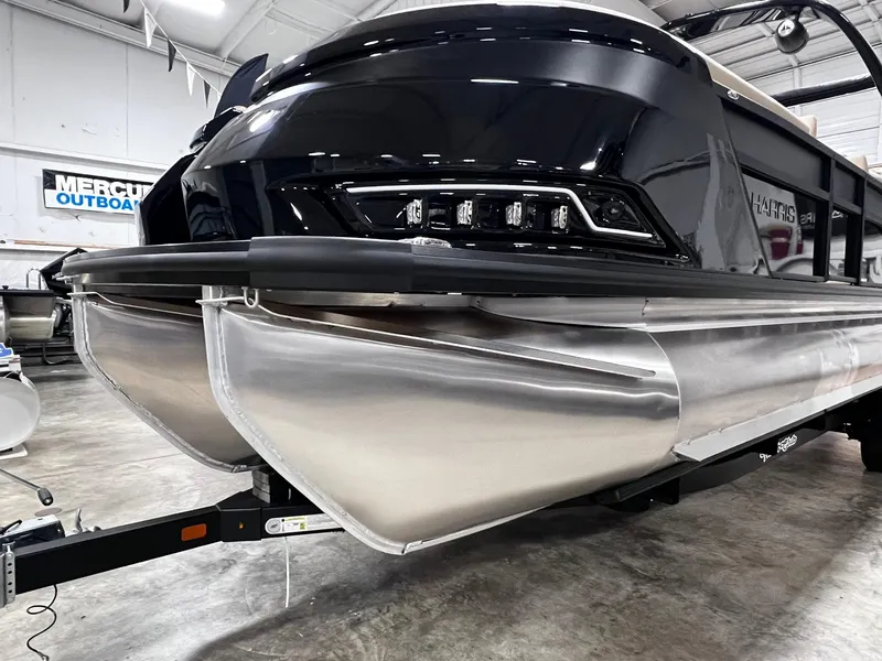 Slide: The Image of 2024 Harris 250 Grand Mariner V10 400 pontoon boat in showroom, showcasing sleek design. - 22