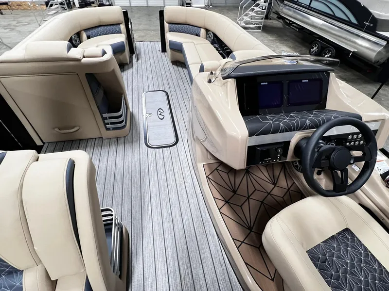 Slide: The Image of 2024 Harris 250 Grand Mariner V10 400 interior with luxurious seating and modern dashboard. - 9