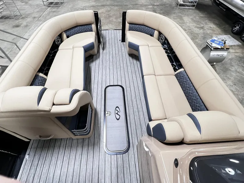 Slide: The Image of 2024 Harris 250 Grand Mariner V10 400 boat interior with beige seating and sleek flooring. - 11