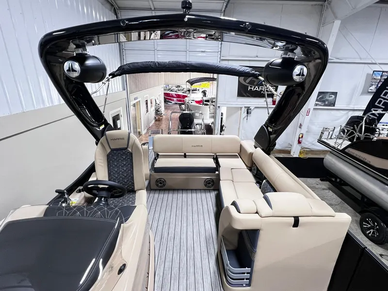 Slide: The Image of 2024 Harris 250 Grand Mariner V10 400 luxury boat interior with spacious seating and modern design. - 13