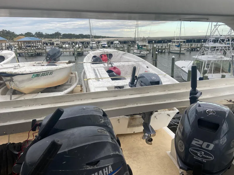Slide: The Image of Boats docked at a marina, featuring a Custom Mothership model from 1995. - 5