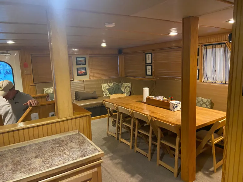 Slide: The Image of Interior of 1995 Custom Mothership with dining area and cozy seating. - 7