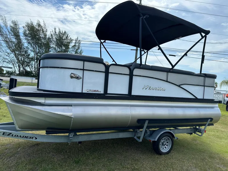 Slide: The Image of 2022 Manitou 18 Aurora pontoon boat on trailer with canopy. - 0