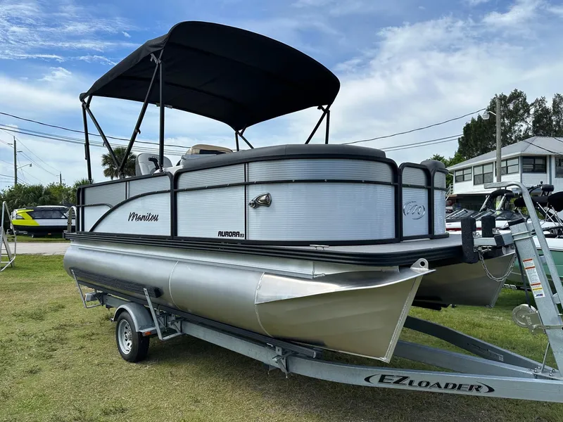 Slide: The Image of 2022 Manitou 18 Aurora pontoon boat on EZ Loader trailer. - 2